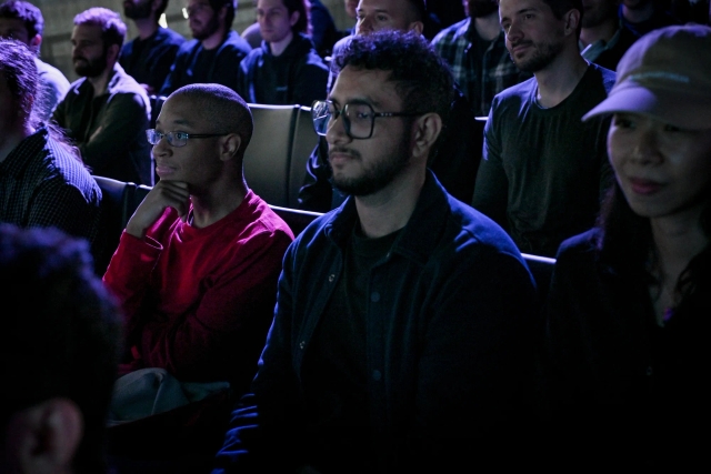 Audience members listening intently to the keynote presentation.